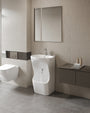 Quba ceramic wudu basin in white, shown in a bathroom setting