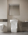 Quba ceramic wudu basin in white, front view in a bathroom